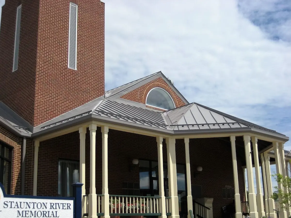 Skilled roofing craftsmen working on a residential roof in Burrillville